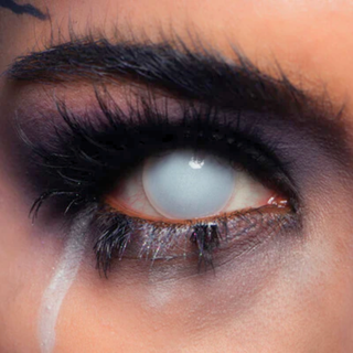 Close-up of eerie eye wearing white blind Halloween contact lenses for a spooky, ghostly look, perfect for horror costumes.