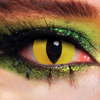 Close-up of eye wearing Wild Cat Halloween Contact Lenses with vibrant yellow and black colors, enhanced by green makeup.