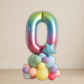 Rainbow number balloon stack featuring a large rainbow foil number zero, perfect for colorful milestone events and celebrations.
