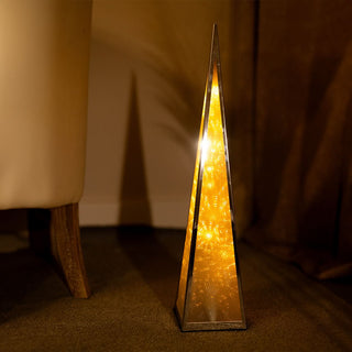 Illuminated gold Christmas Pyramid LED Lights cone-shaped decoration in elegant room setting