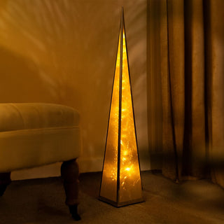 Christmas Pyramid LED Lights in gold, illuminating corner of room with warm festive glow, part of 2pc decorative set.