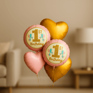 Girls 1st Birthday helium balloon bouquet in pink and gold with heart shapes for girl's first milestone celebration.