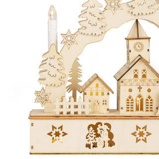Christmas Village Candle Bridge featuring snow-topped houses and pine trees with LED lighting for festive home decor.