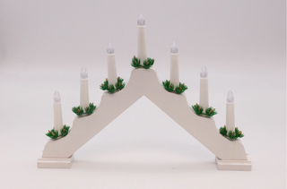 7 Bulb White Wooden Christmas Candle Bridge with decorative greenery, perfect for holiday windowsills and mantels.