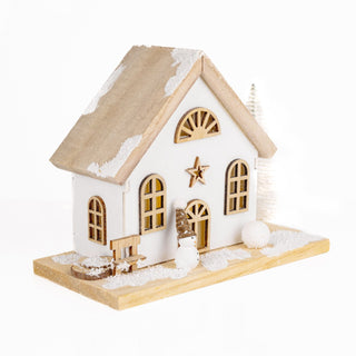 LED Christmas house village scene - Wooden festive light-up display with snowy details and glowing windows.