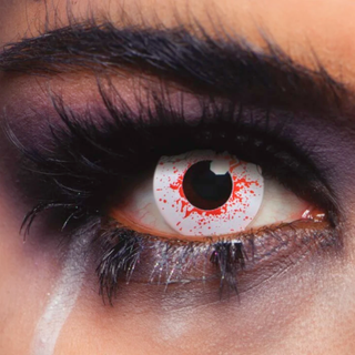 Close-up of an eye with Bloodshot Effect Eye Drops for a Halloween red-eye look.