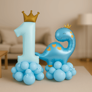 Prince & Princess Dino 1st Birthday Balloon Stack Display with crown-topped number 1 and blue dinosaur balloon for kids' party decor.