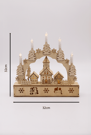 Christmas Village Candle Bridge with LED lights featuring snow-topped houses and pine trees, perfect festive decoration.